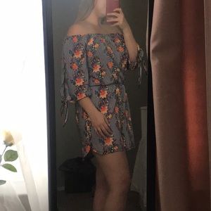 Multi orange floral striped romper.